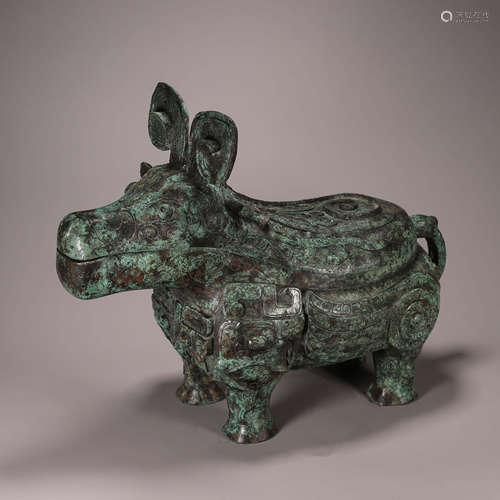 A taotie patterned bronze goat head pot