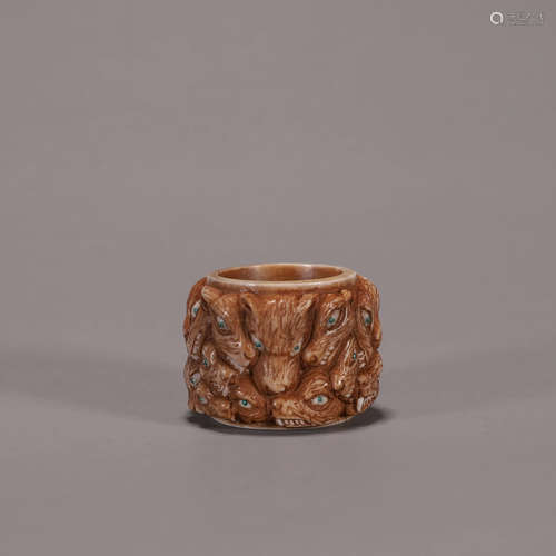 An antler wolf head thumb ring