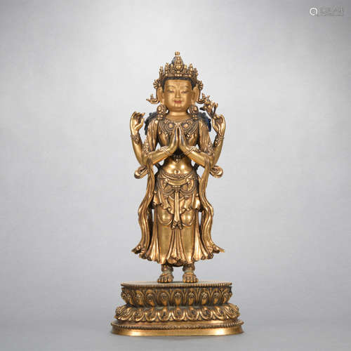 A gilt-bronze statue of Four arm Avalokitesvara