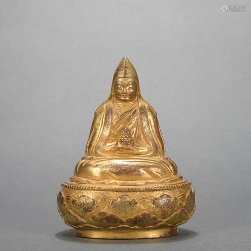 A gilt-bronze statue of Master Buddha