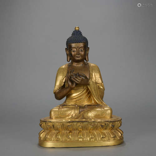 A gilt-bronze statue of Shakya Muni