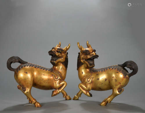 A pair of gilt-bronze unicorn