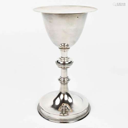 A French gothic revival silver chalice, with a paten and spo...