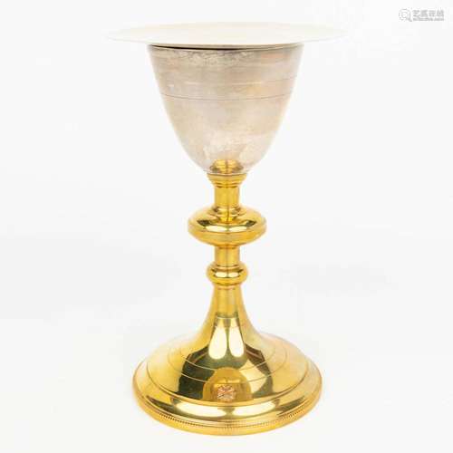 A gold-plated silver chalice made in neogothic style and mar...