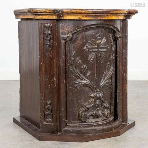 An antique tabernacle, with images of a crucifix. Middle of ...