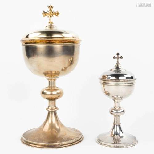 A collection of 2 ciboria made of silver, of which one is ma...