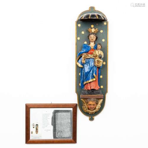 A statue of Madonna with child mounted in a young stand. (H:...