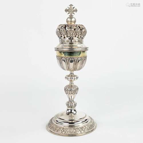 A ciboria made of silver with an open-worked crown. Marked w...