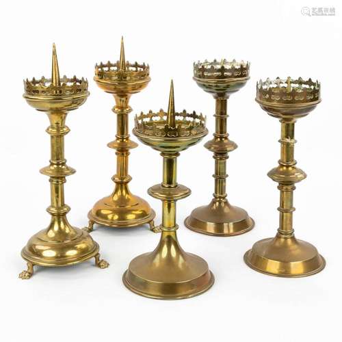 A collection of 5 candlesticks made of bronze and copper in ...