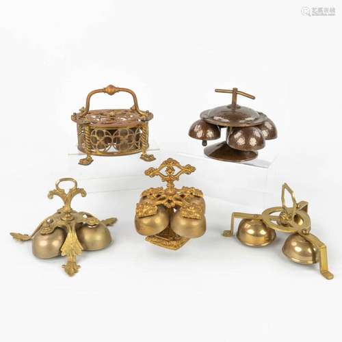 An assembled collection of 5 Altar Bells, made of various me...