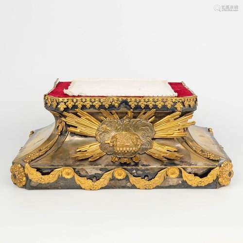 A base for a statue, made of wood finished with brass and an...