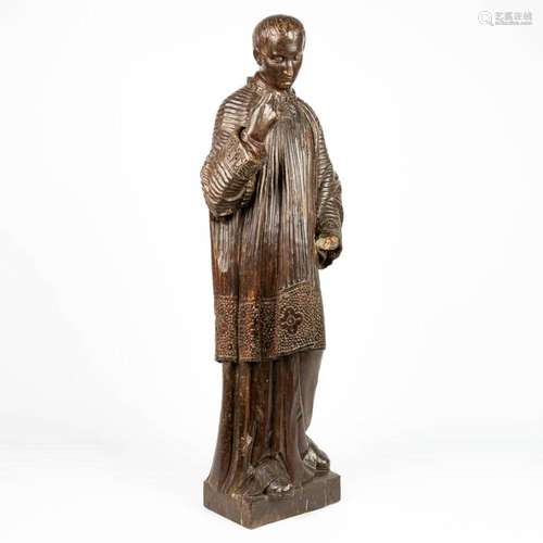 A wood sculpture of a priest, 19th century. (H:103cm)