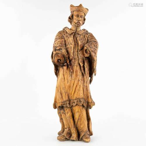 An antique wood sculptured statue of a holy figurine, made i...