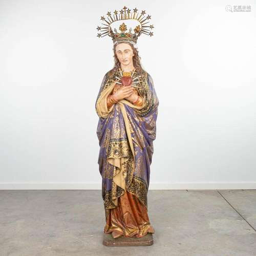 A statue 'Our Lady of Sorrows' made of polychrome pl...