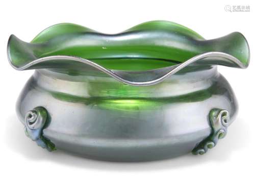 AN ART NOUVEAU GREEN GLASS BOWL, with undulating rim, applie...