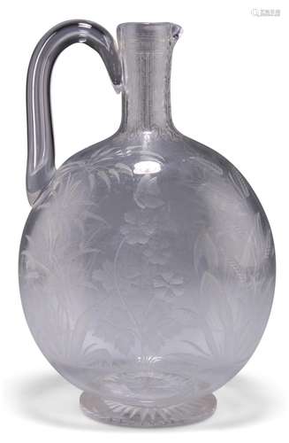 A GLASS CLARET JUG, CIRCA 1870, the bulbous body engraved wi...