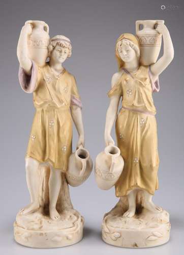 A PAIR OF ROYAL DUX FIGURES, modelled as Grecian water carri...