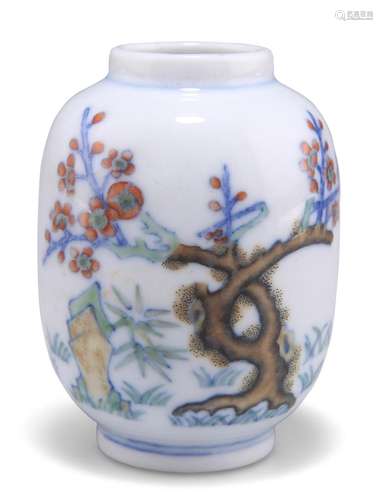 A CHINESE SMALL DOUCAI VASE, painted to one side with a gnar...