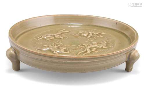 A CHINESE CELADON DISH, circular, moulded with figures and d...