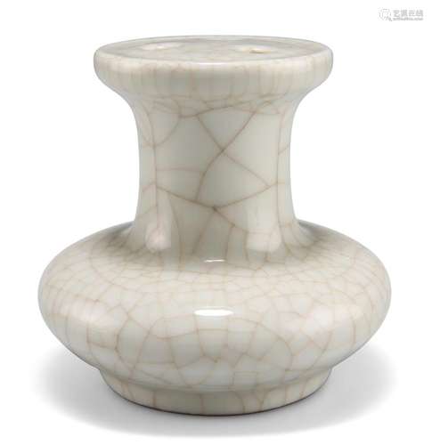 A CHINESE CELADON VASE, of squat form, the enclosed top with...