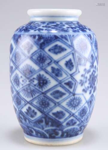 A CHINESE SMALL BLUE AND WHITE VASE, ovoid, painted with flo...