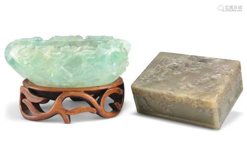 A CHINESE CARVED FLUORITE BOWL, carved with prunus, to a har...