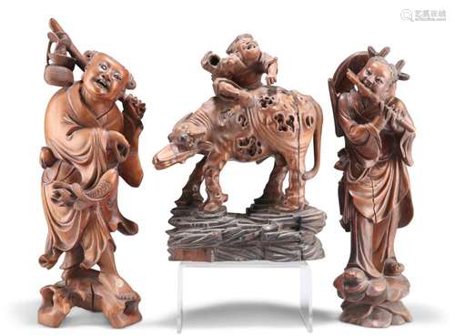 THREE 19TH CENTURY CHINESE WOODEN CARVINGS, including a grou...