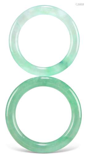 TWO GREEN JADE BANGLES. (2) 6.2cm inner diameter, 5mm wide, ...