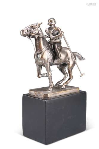 A CHROME-PLATED FIGURE OF A POLO PLAYER ON HORSEBACK, on a t...