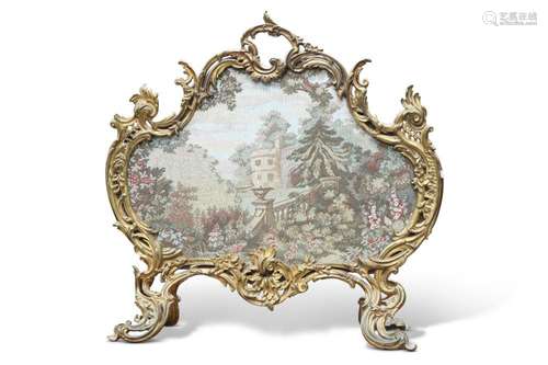 A 19TH CENTURY ROCOCO-STYLE GILT-METAL FIRESCREEN, cast with...