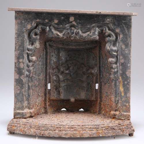 A VICTORIAN CAST IRON MINIATURE FIRE PLACE. 21cm high