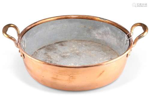 A COPPER TWO-HANDLED CREAM PAN, with liner. 56cm across hand...