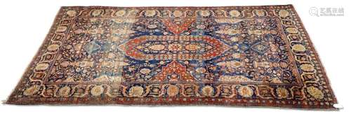 A PERSIAN KASHAN SMALL CARPET, CIRCA 1900, hand-knotted, the...