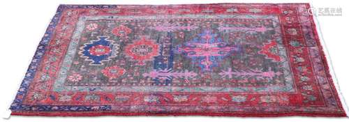 A PERSIAN LORI RUG, hand-knotted, the grey field with repeat...