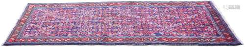 A PERSIAN MAHAL RUNNER, hand-knotted, the bright blue field ...