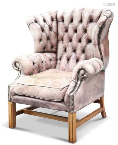 A GEORGIAN-STYLE LEATHER UPHOLSTERED WING-BACK ARMCHAIR, wit...