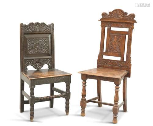 TWO VICTORIAN CARVED OAK HALL CHAIRS, each with panel back a...