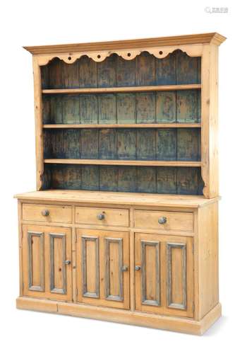 A PINE DRESSER AND RACK, the upper section with three shelve...