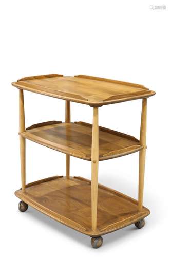 AN ERCOL LIGHT ELM TEA TROLLEY, the three rounded rectangula...