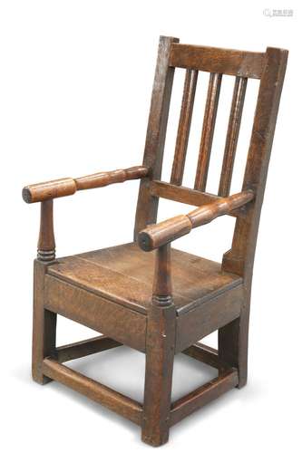 AN OAK CHILD'S ELBOW CHAIR, CIRCA 1800, with plank seat,...