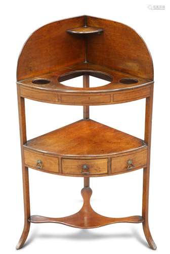 A GEORGE III MAHOGANY CORNER WASHSTAND, fitted with a drawer...