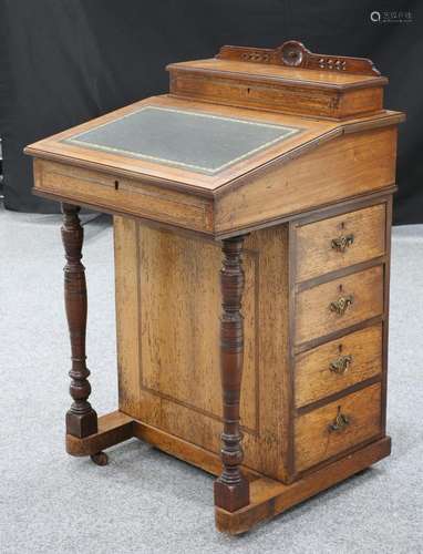 A LATE VICTORIAN INLAID ROSEWOOD DAVENPORT, with gilt-tooled...