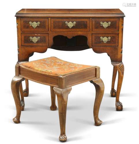 A QUEEN ANNE-STYLE WALNUT DRESSING TABLE, with half-veneered...