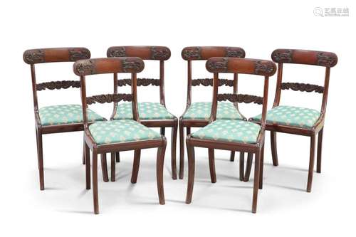 A SET OF SIX REGENCY ROSEWOOD DINING CHAIRS, each with scrol...