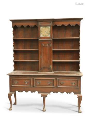 AN 18TH CENTURY-STYLE OAK CLOCK DRESSER, the boarded rack wi...