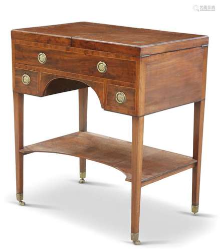 A SHERATON PERIOD MAHOGANY DRESSING TABLE, with twin hinged ...