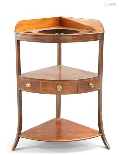 A GEORGE III MAHOGANY CORNER WASH STAND, fitted with one dra...