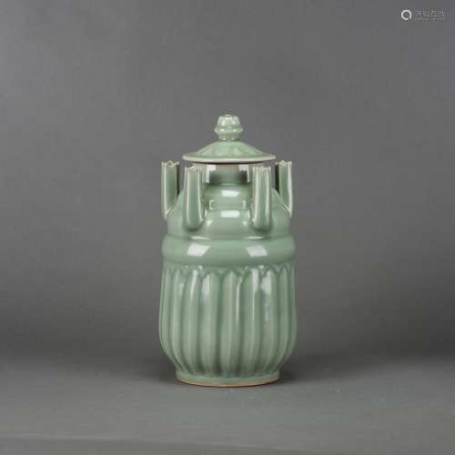 A CHINESE LONGQUAN CELADON FIVE-SPOUT JARS AND COVERS