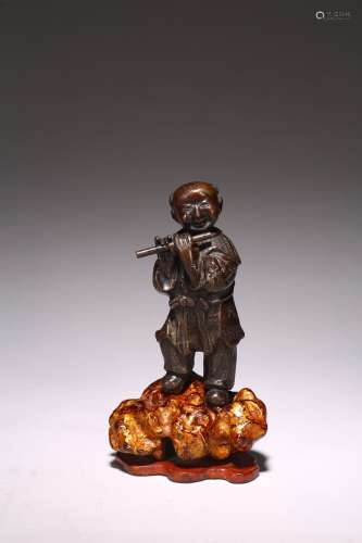 A CHINESE BRONZE 'BOY PLAYING FLUTE'