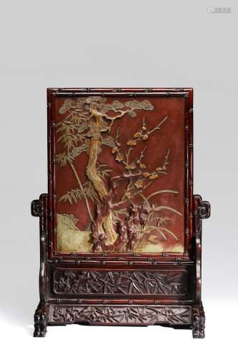 A CARVED QIYANG 'FLOWERS' TABLE SCREEN